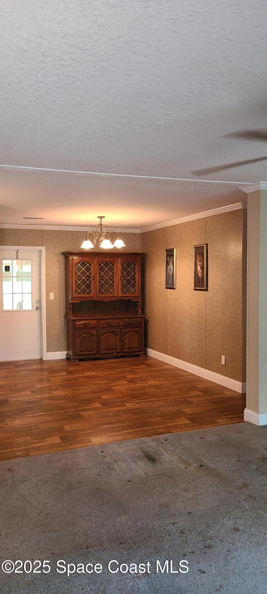 17189 County Road 252 Live Oak, FL 32060 - Photo 9 of 31 a view of an empty room with window and fireplace