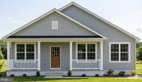 a view of front a house with a yard