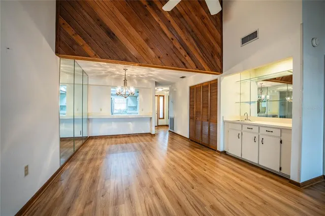 a view of hallway with wooden floor