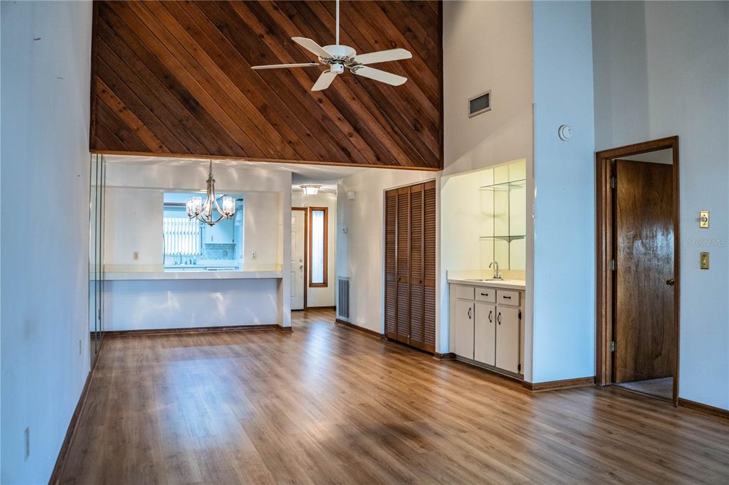 2025 Sylvester Road, Unit AA1 Lakeland, FL 33803 - Photo 14 of 65 a view of an empty room with wooden floor and a window