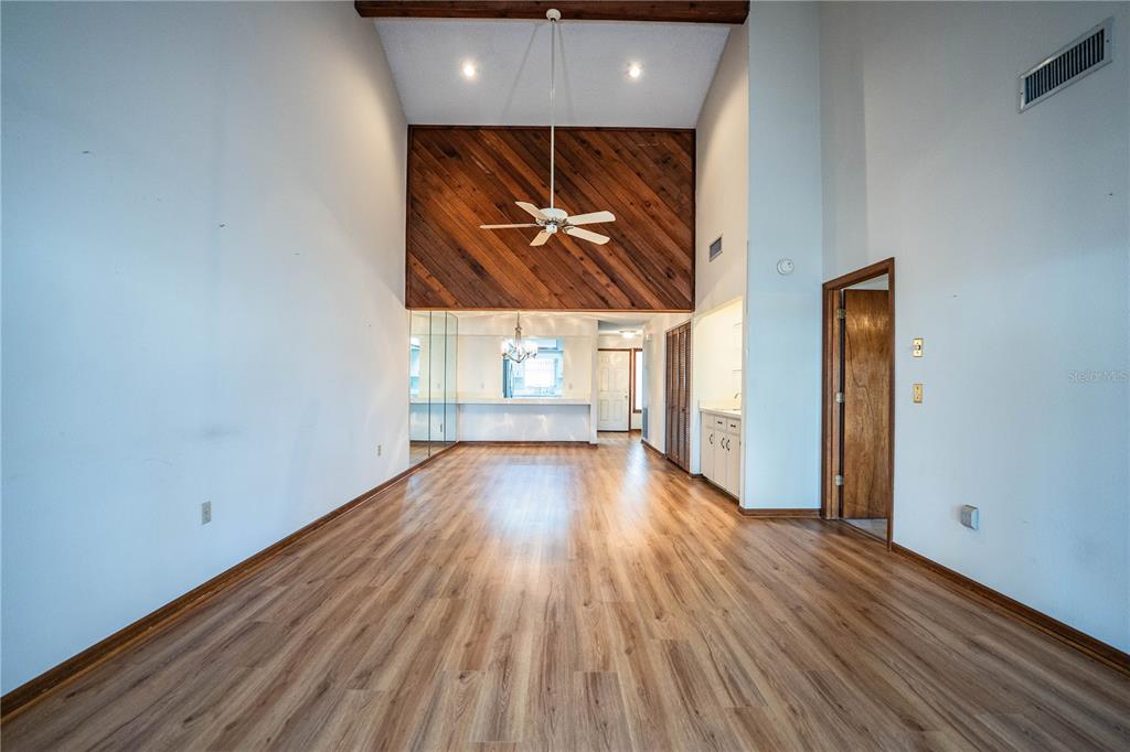 2025 Sylvester Road, Unit AA1 Lakeland, FL 33803 - Photo 15 of 65 a view of hallway with wooden floor