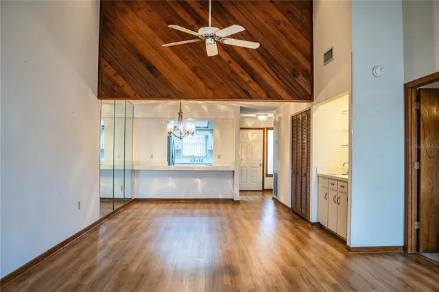 a view of hallway with wooden floor