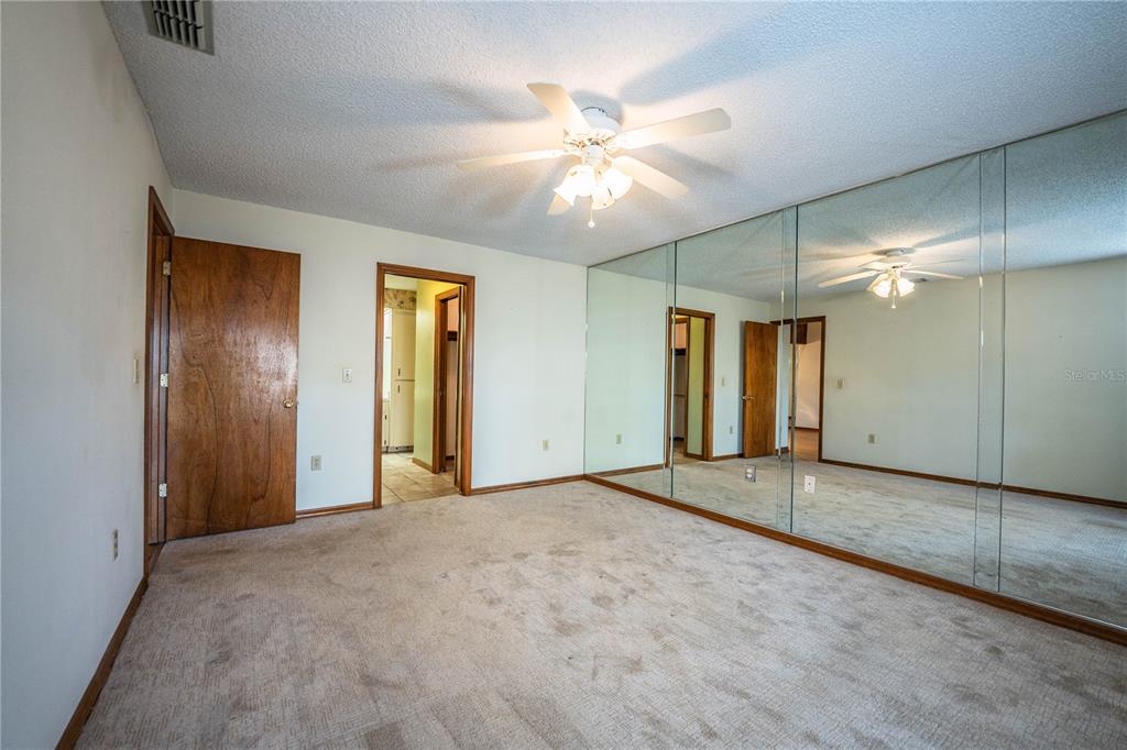 2025 Sylvester Road, Unit AA1 Lakeland, FL 33803 - Photo 26 of 65 an empty room with fan and entrance