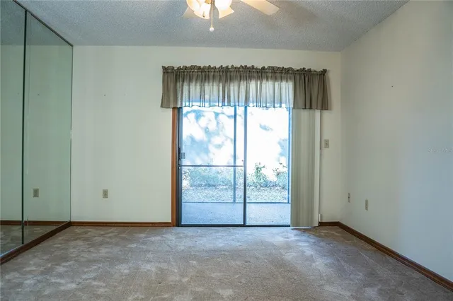 a view of an empty room and window