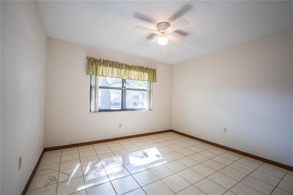 2025 Sylvester Road, Unit AA1 Lakeland, FL 33803 - Photo 37 of 65 an empty room with windows and fan