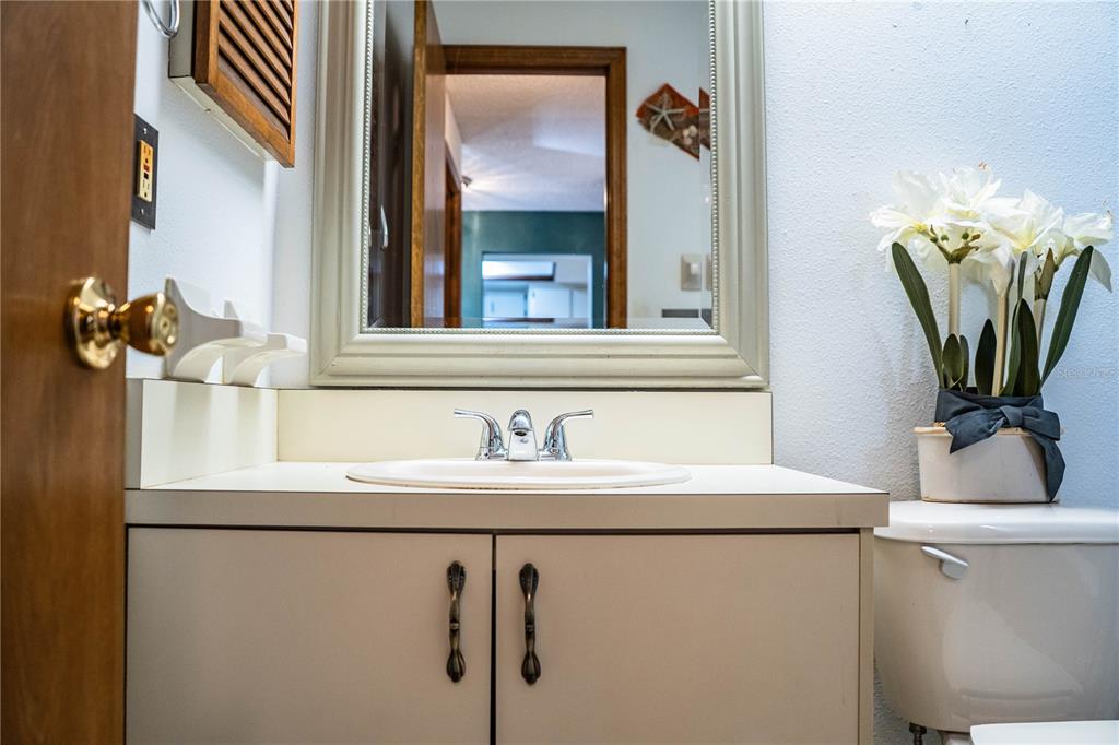 2025 Sylvester Road, Unit AA1 Lakeland, FL 33803 - Photo 39 of 65 a bathroom with a sink and a mirror