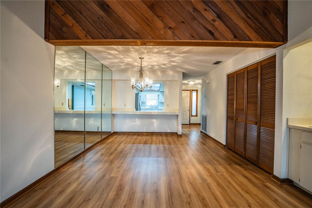 2025 Sylvester Road, Unit AA1 Lakeland, FL 33803 - Photo 4 of 65 a view of a room with wooden floor