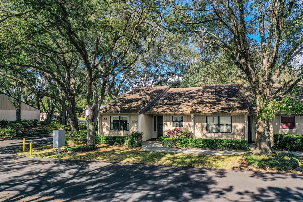 2025 Sylvester Road, Unit AA1 Lakeland, FL 33803 - Photo 53 of 65 a front view of a house with a yard