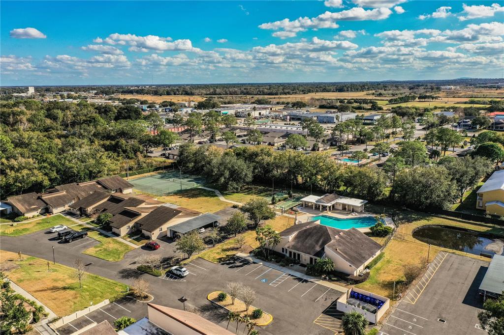 2025 Sylvester Road, Unit AA1 Lakeland, FL 33803 - Photo 58 of 65 an aerial view of residential houses with outdoor space
