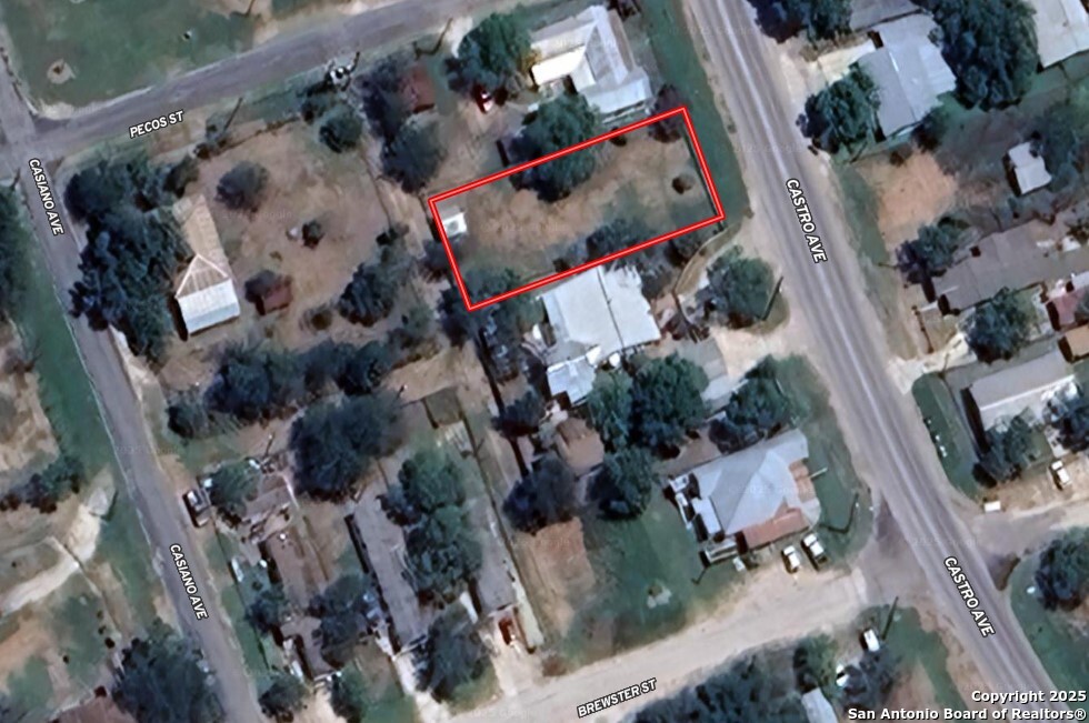 an aerial view of residential house with outdoor space and swimming pool