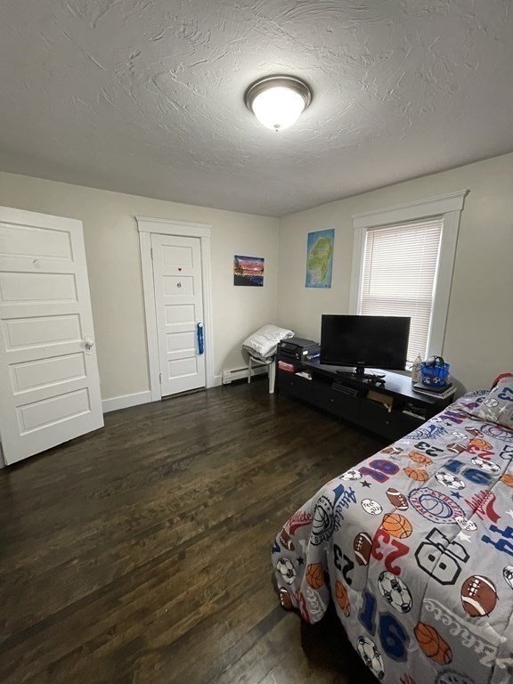 9 Thayer Street Worcester, MA 01603 - Photo 13 of 18 a bedroom with bed and a view of bedroom
