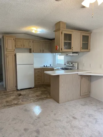 a kitchen with a sink stainless steel appliances and cabinets