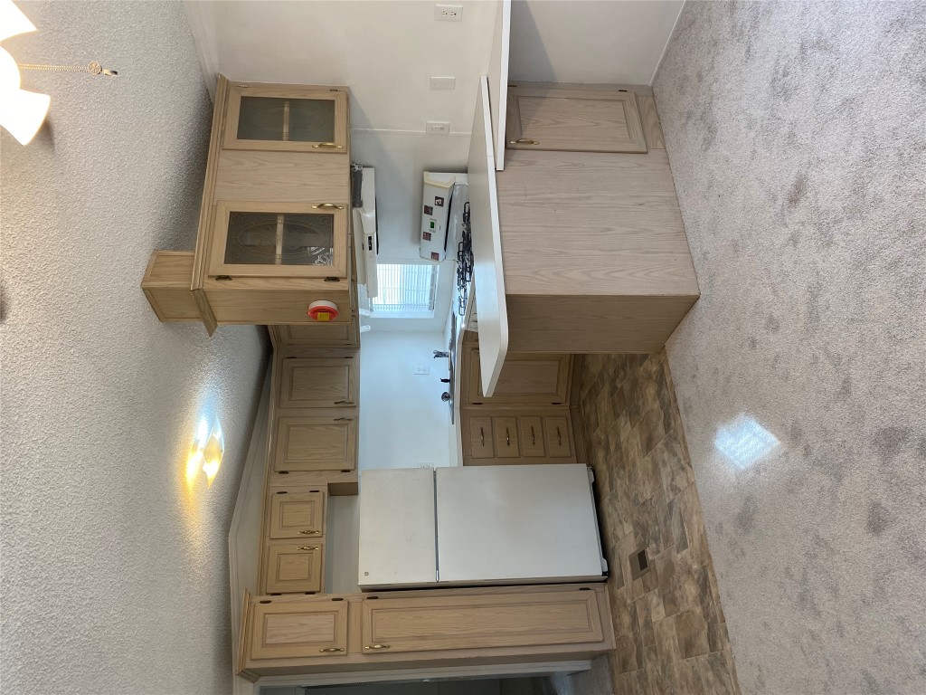125 Kellar Road, Unit 1 Smithville, TX 78957 - Photo 17 of 18 a kitchen with a sink stainless steel appliances and cabinets