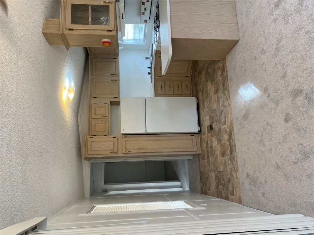 125 Kellar Road, Unit 1 Smithville, TX 78957 - Photo 8 of 18 a view of a kitchen with a sink and cabinets