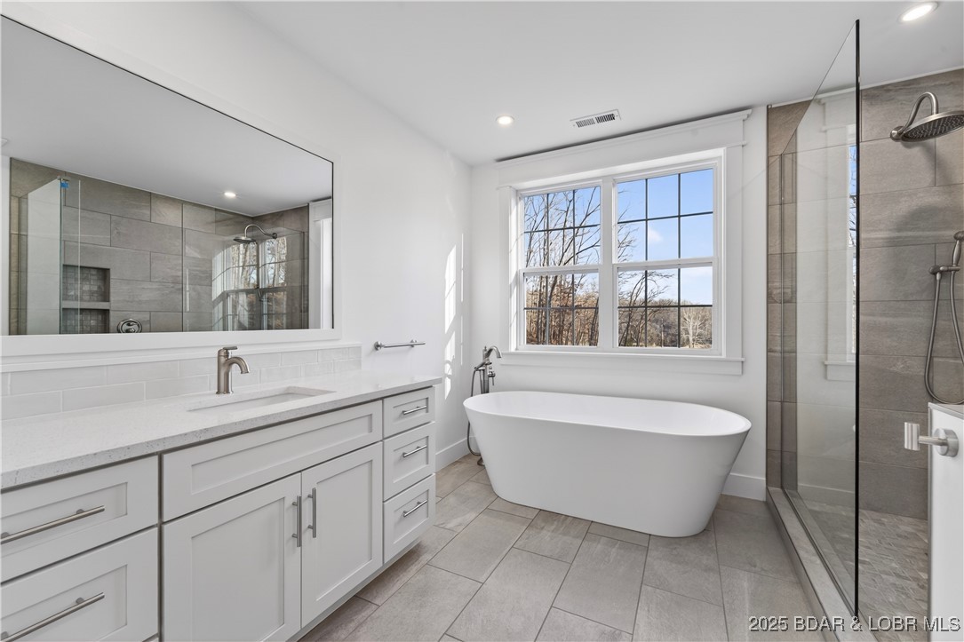 109 Allen Road Eldon, MO 65026 - Photo 40 of 58 Upper level bathroom with soaker tub