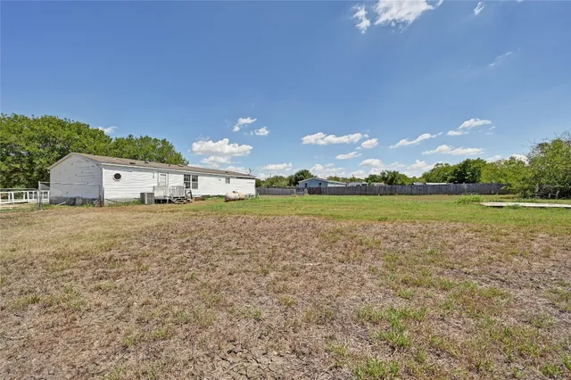 a view of a lake with houses in the background