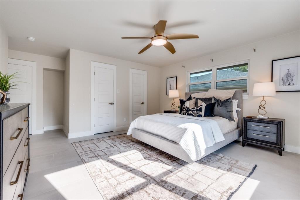 7115 Meadow Road Dallas, TX 75230 - Photo 11 of 22 This property features a bright room with light-colored walls and flooring, complemented by windows providing natural light