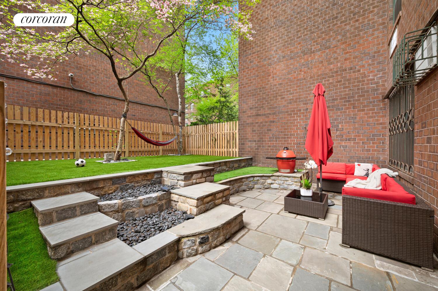 618 Washington Street, Unit GA Manhattan, NY 10014 - Photo 3 of 14 a backyard of a house with outdoor seating