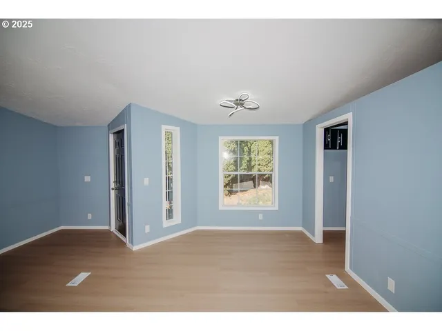 a view of an empty room with a window