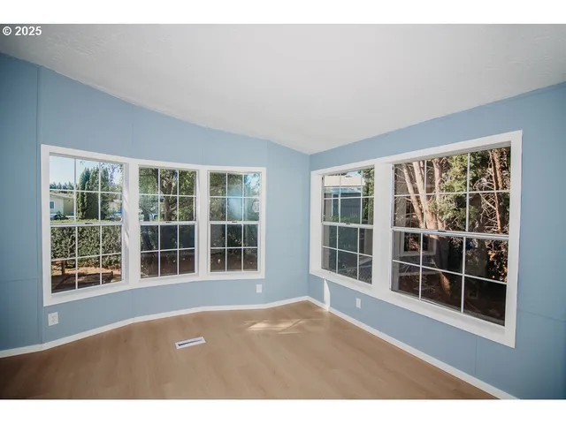 a view of empty room with windows