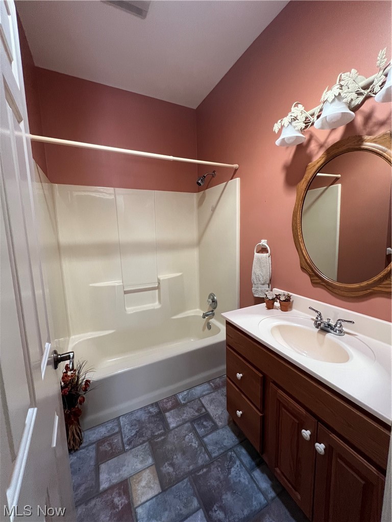 185 B Mathews Road Youngstown, OH 44512 - Photo 22 of 35 Bathroom with vanity, tile flooring, mirror, and tub / shower combination