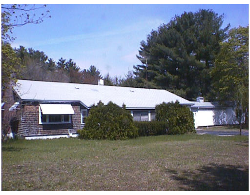 12 Pulpit Rock Road Pelham, NH 03076 - Photo 1 of 1 a view of a house with a yard