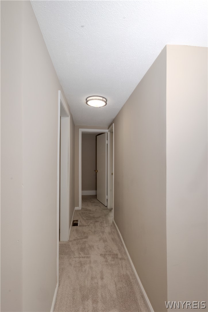 9380 Warsaw Road Le Roy, NY 14482 - Photo 19 of 32 Hallway to bedrooms