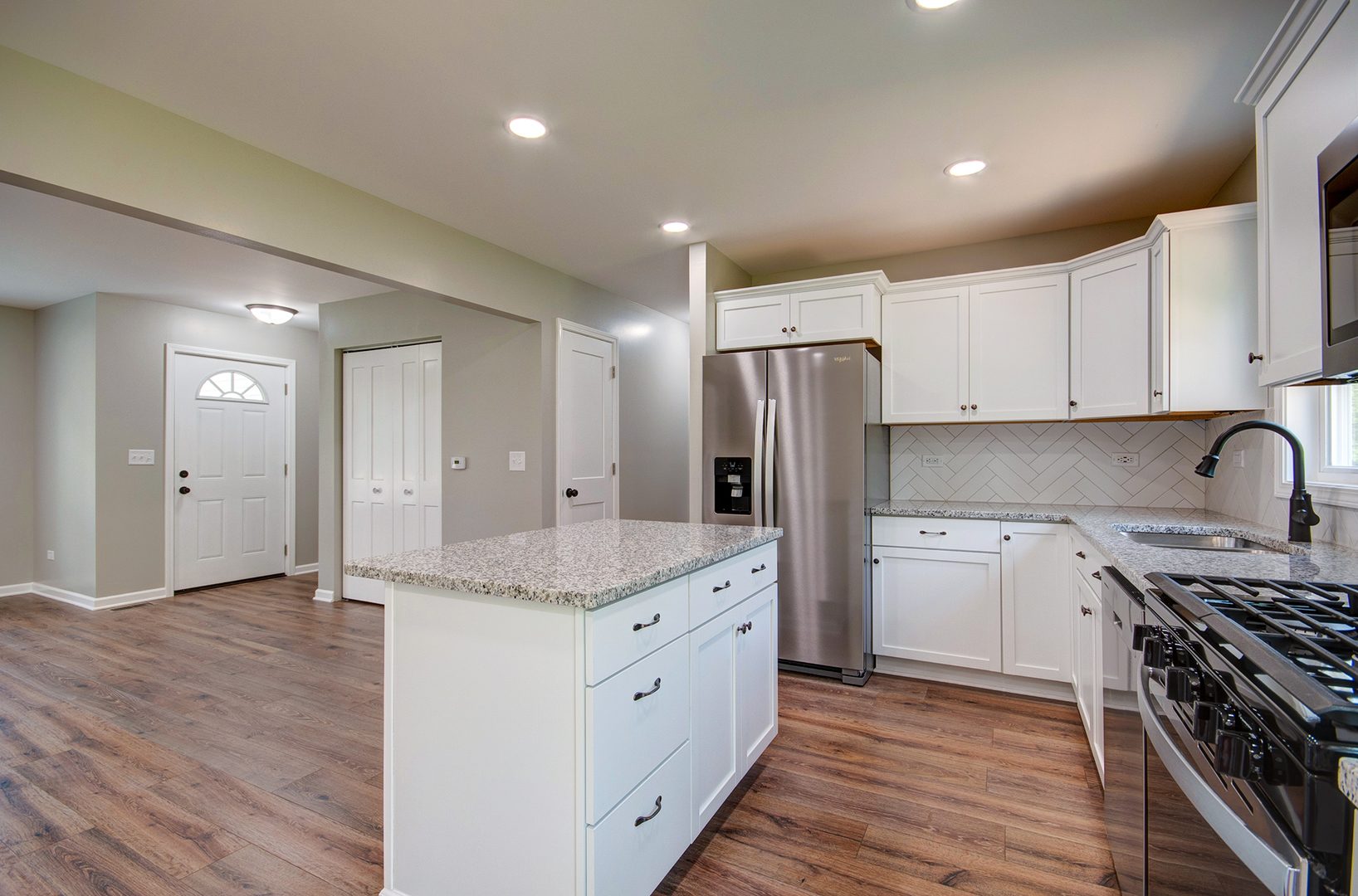 386 West 3rd Street Braidwood, IL 60408 - Photo 11 of 36 a kitchen with stainless steel appliances granite countertop a sink stove and refrigerator
