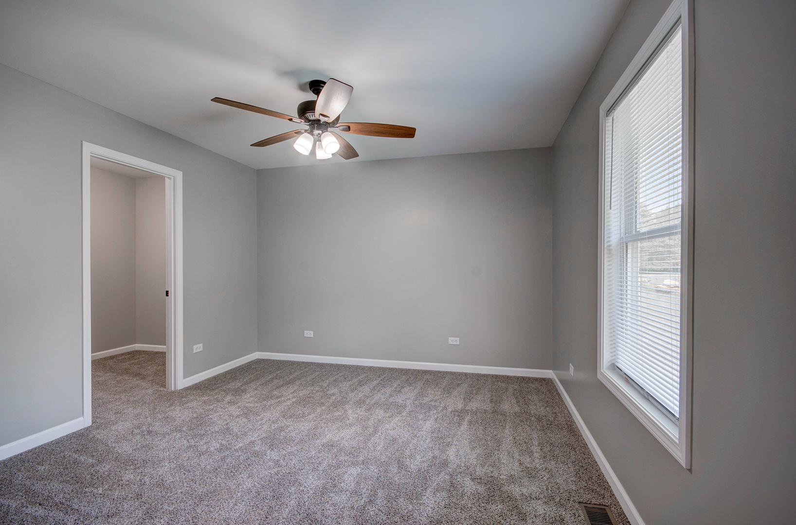 386 West 3rd Street Braidwood, IL 60408 - Photo 15 of 36 a view of room with a ceiling fan and window