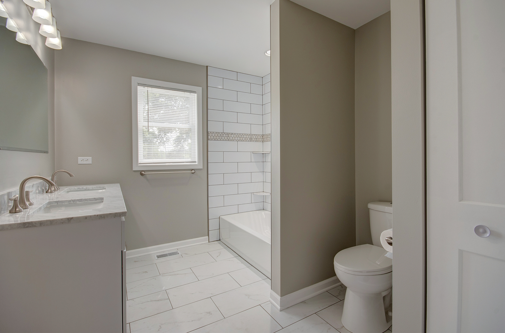 386 West 3rd Street Braidwood, IL 60408 - Photo 22 of 36 a bathroom with a sink toilet and window