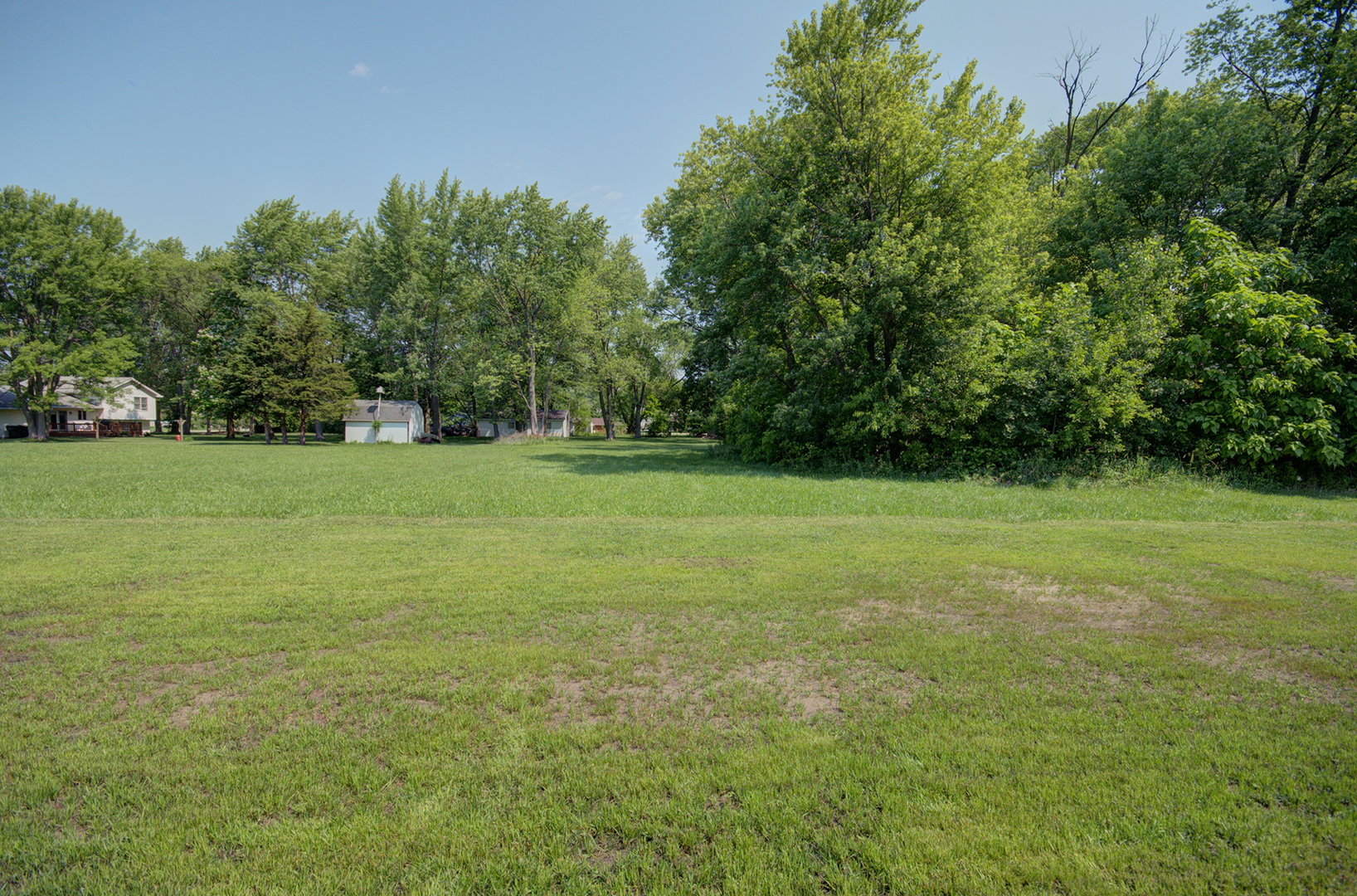 386 West 3rd Street Braidwood, IL 60408 - Photo 36 of 36 a view of a green field with trees in the background