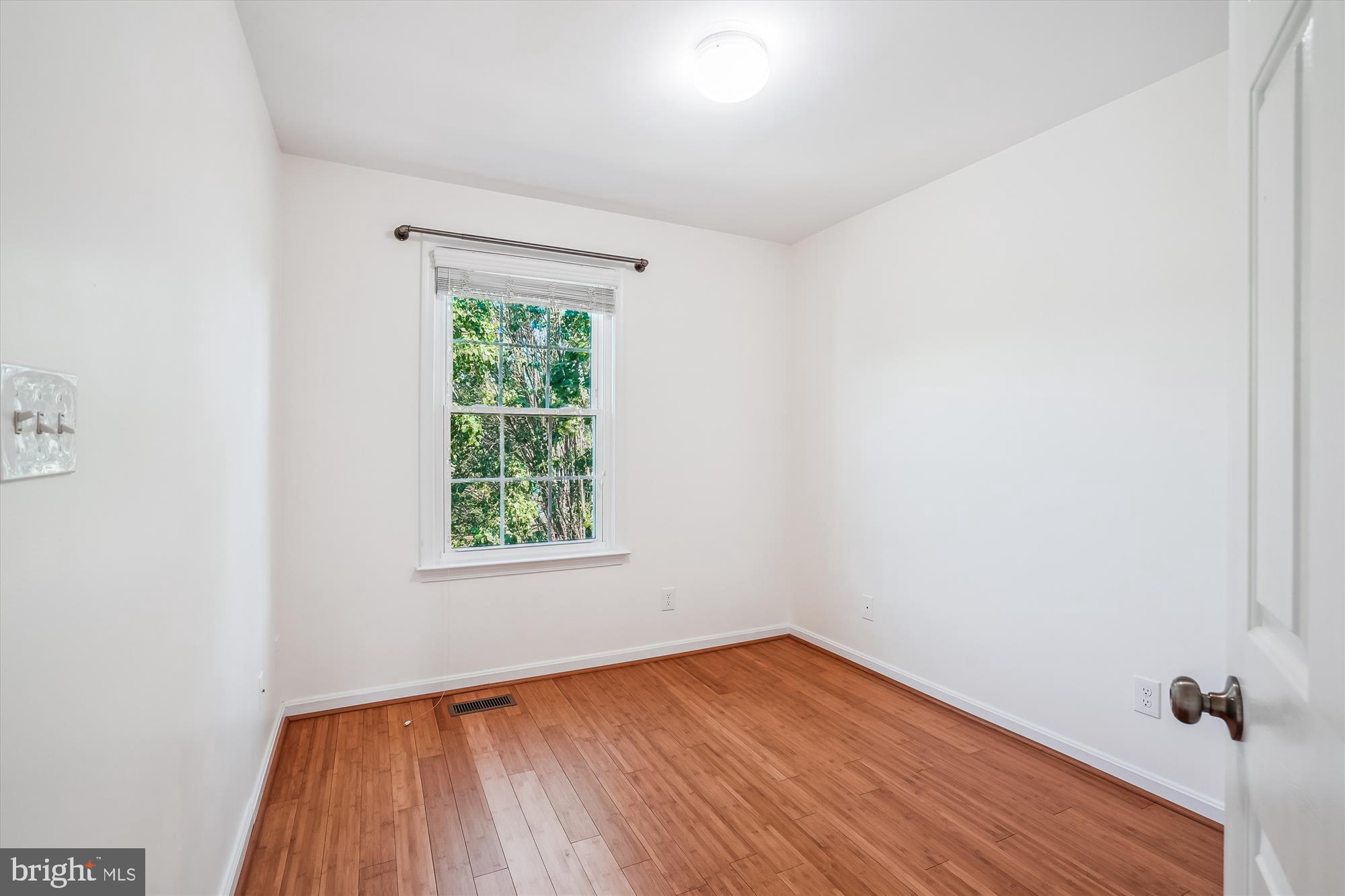 608 Torbert Loop Stafford, VA 22554 - Photo 12 of 24 an empty room with a window and wooden floor