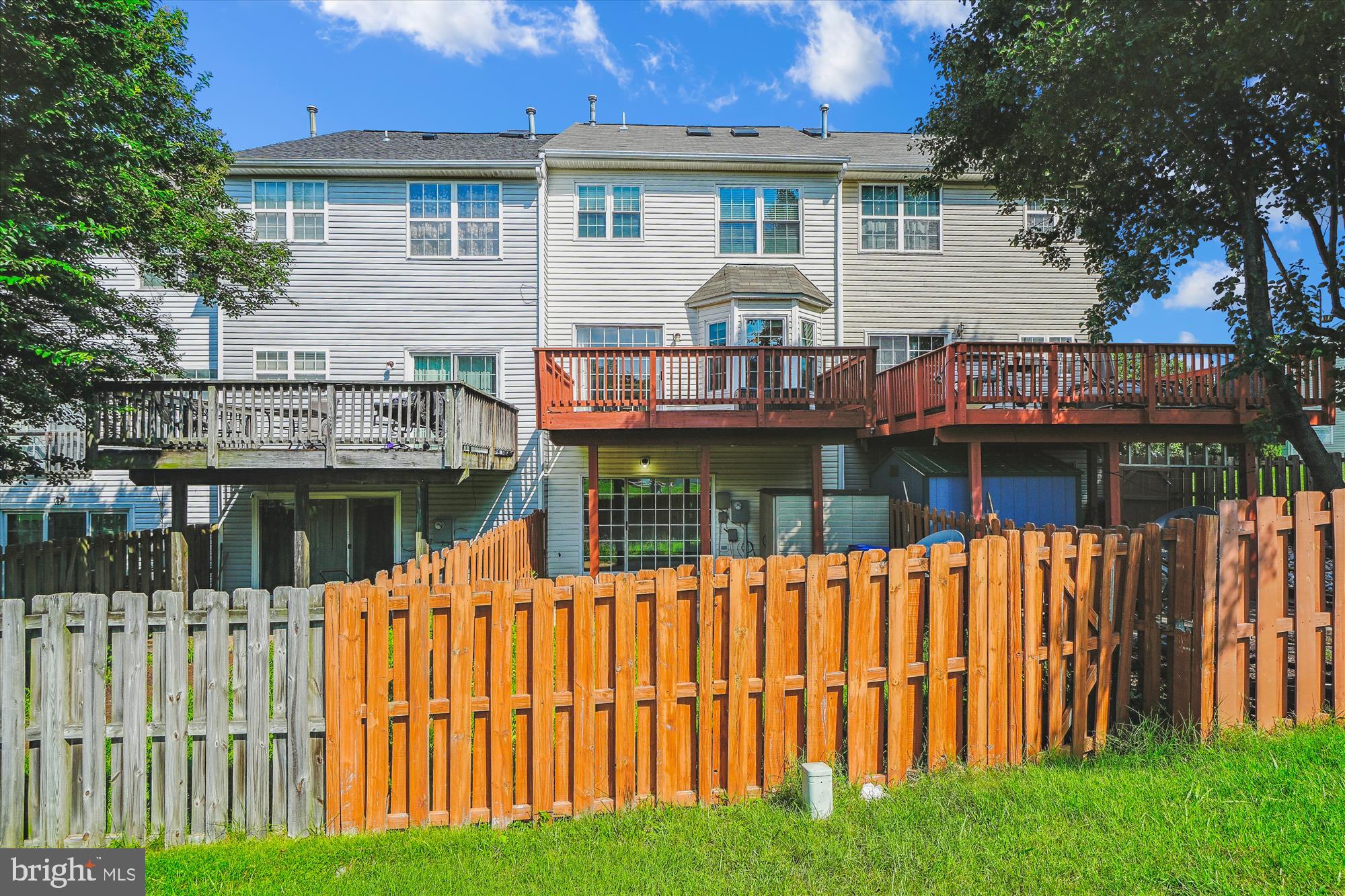608 Torbert Loop Stafford, VA 22554 - Photo 20 of 24 a view of a house with wooden deck and a small yard