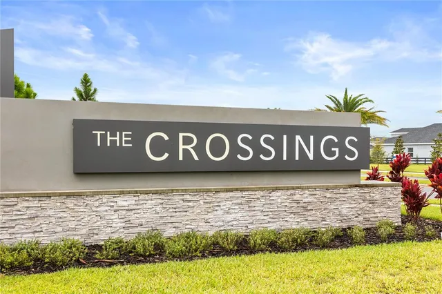 a sign that is on a brick wall