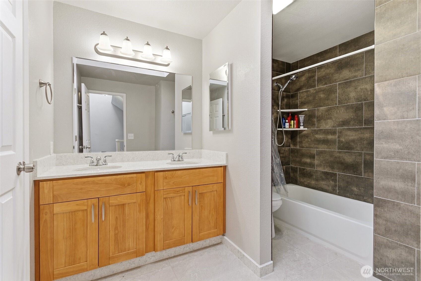 1802 Maple Lane, Unit A5 Kent, WA 98030 - Photo 14 of 27 a bathroom with a granite countertop sink a mirror and a bathtub