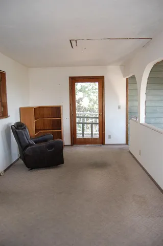 a bathroom with windows and tub