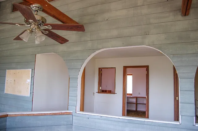 a bathroom with a glass shower door and a mirror