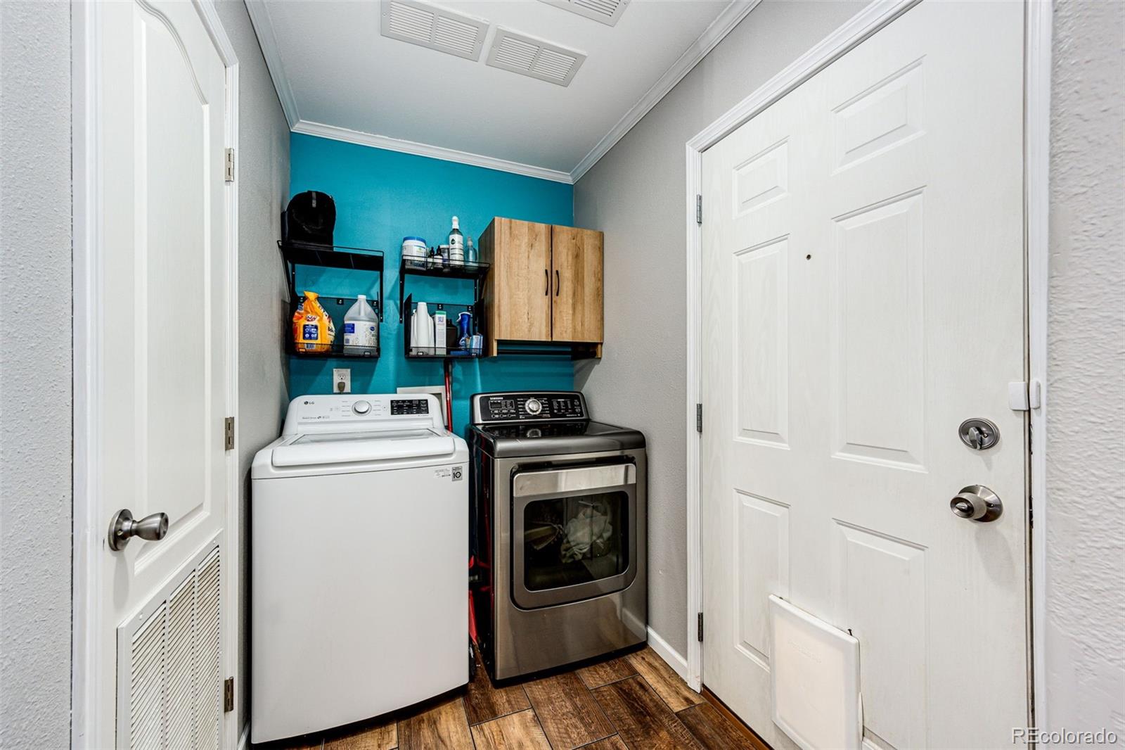 570 4th Street Bennett, CO 80102 - Photo 13 of 36 a view of storage and utility room with washer and dryer