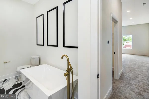 a bathroom with a sink vanity and mirror