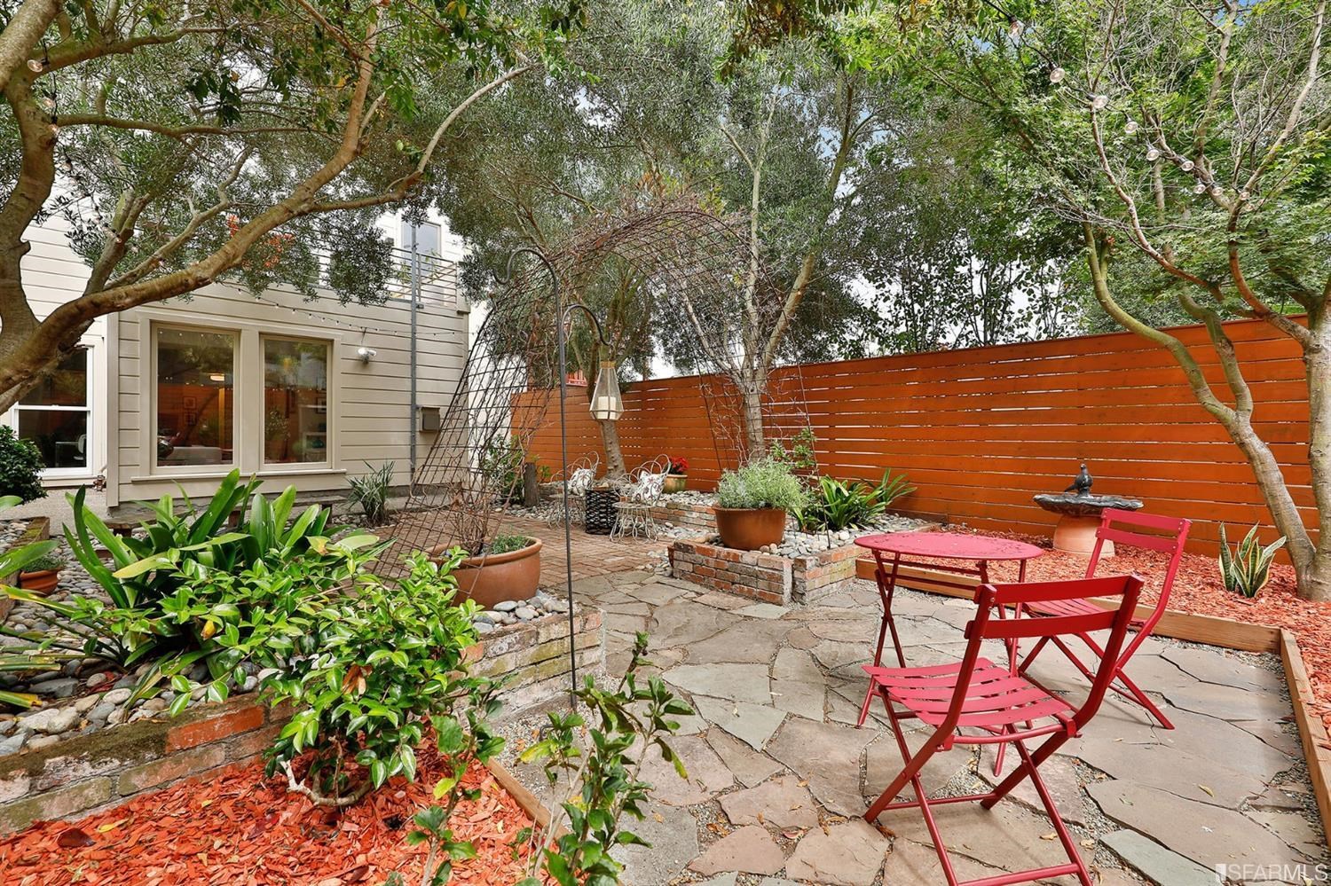 a view of a chairs and table in the patio