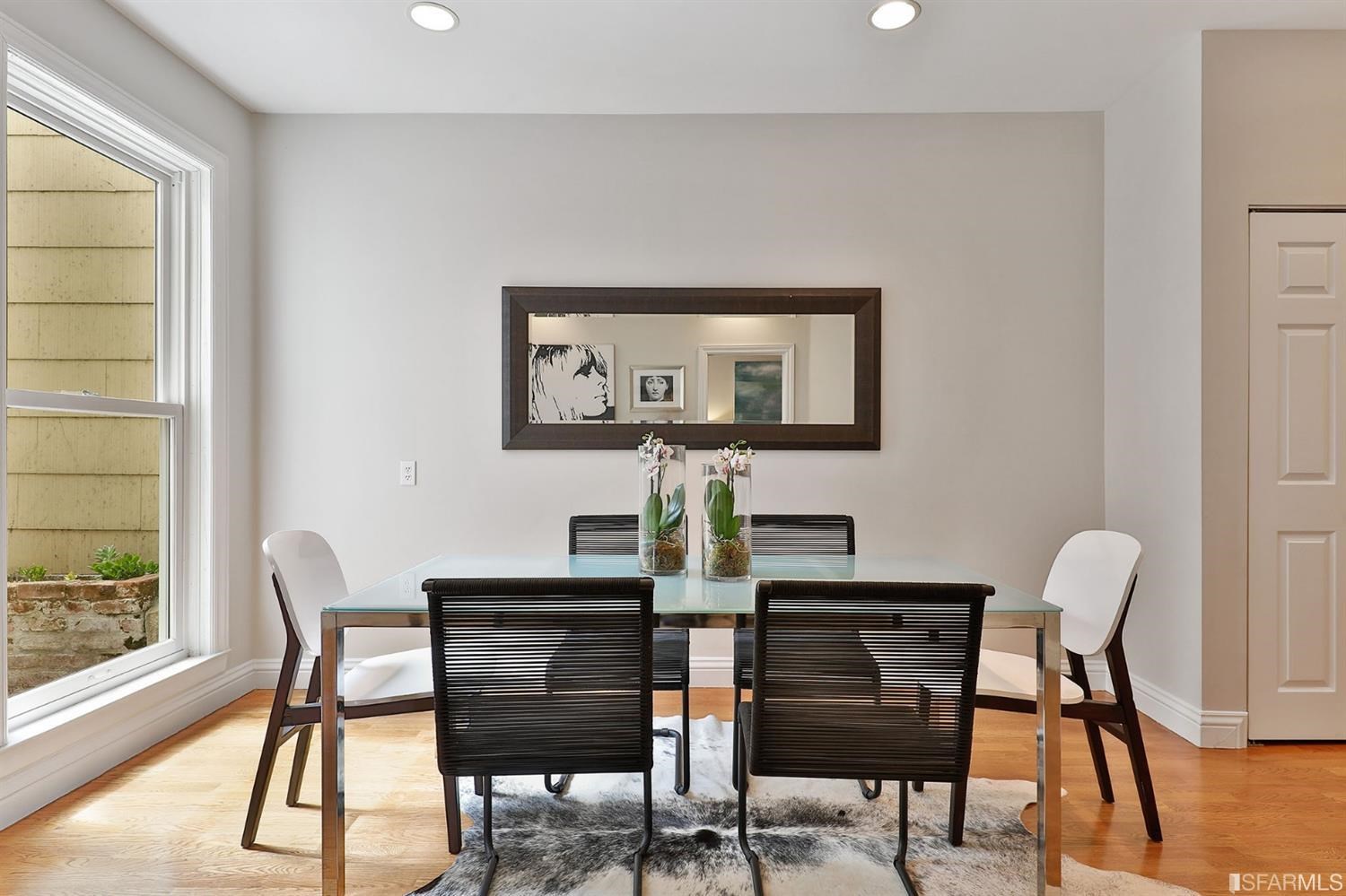 261 Henry Street, Unit A San Francisco, CA 94117 - Photo 11 of 64 a view of a dining room with furniture and wooden floor