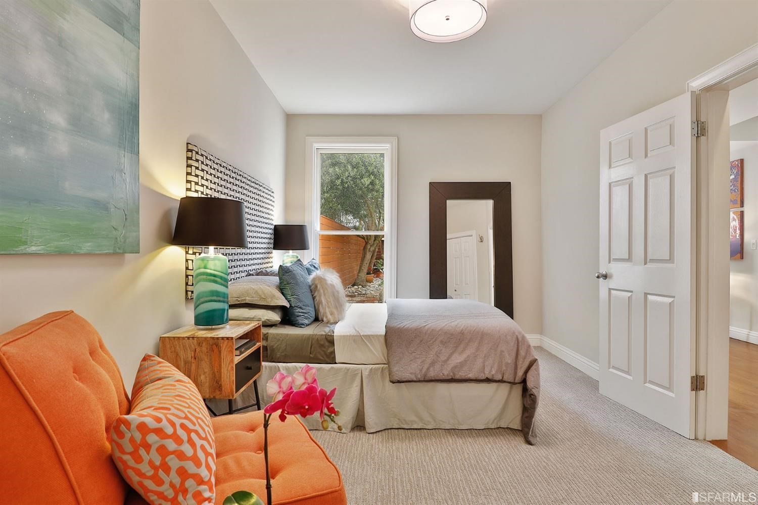 261 Henry Street, Unit A San Francisco, CA 94117 - Photo 21 of 64 a bedroom with furniture and a flat screen tv