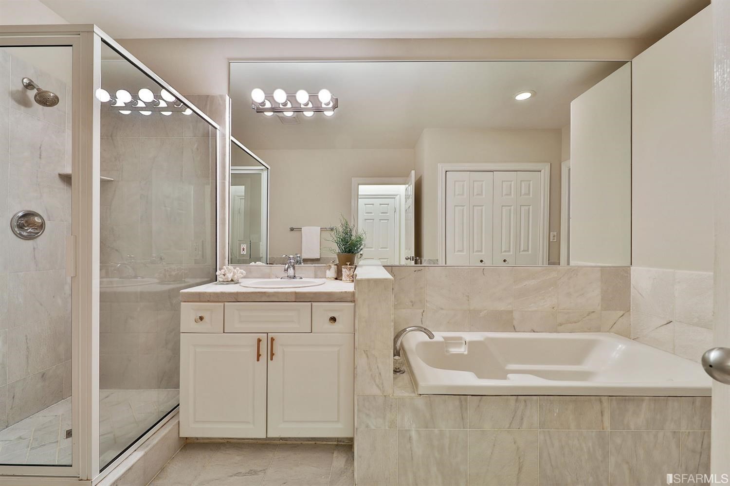 261 Henry Street, Unit A San Francisco, CA 94117 - Photo 23 of 64 a bathroom with a bathtub sink and mirror