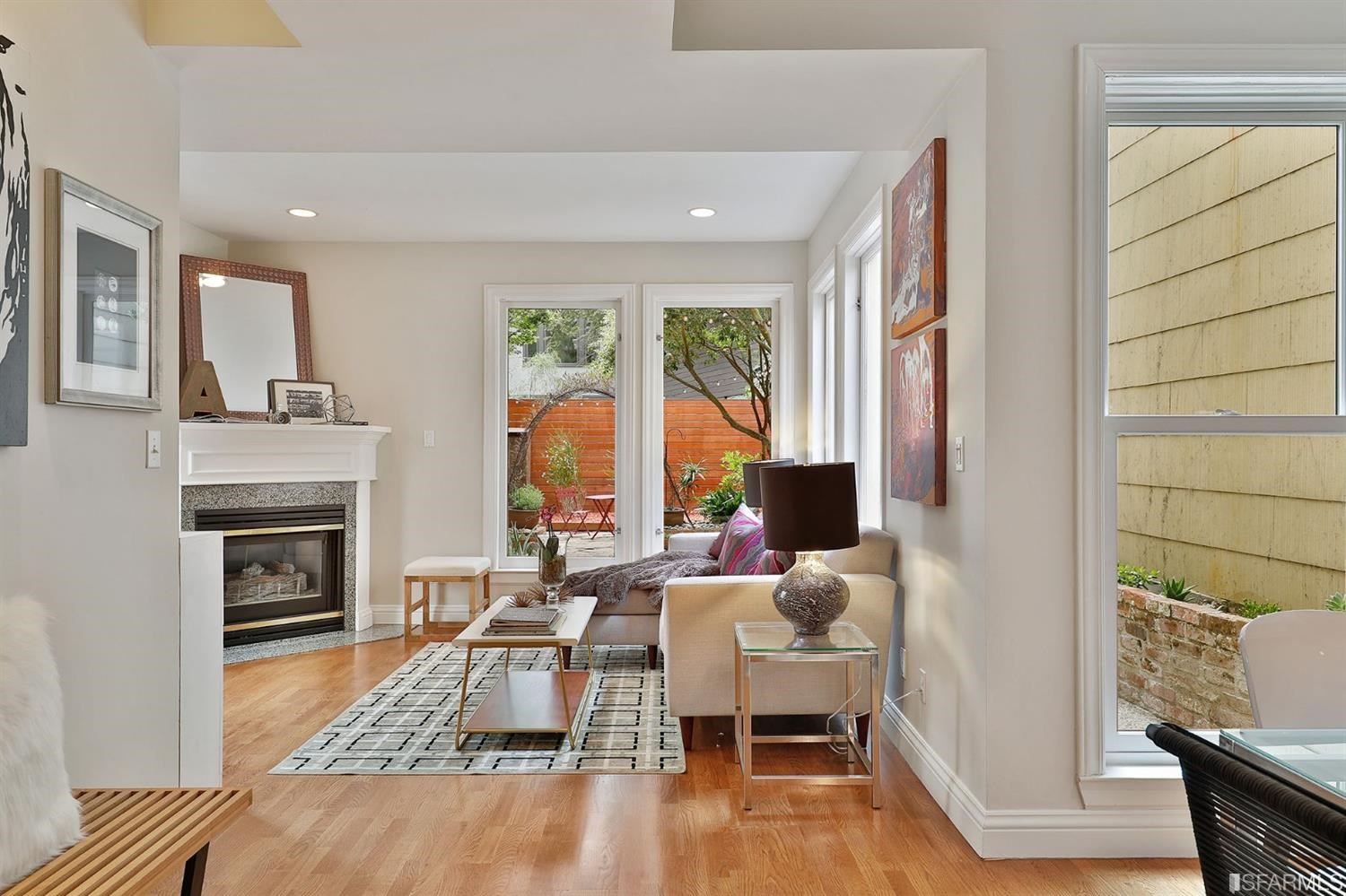 261 Henry Street, Unit A San Francisco, CA 94117 - Photo 3 of 64 a living room with furniture and a fireplace