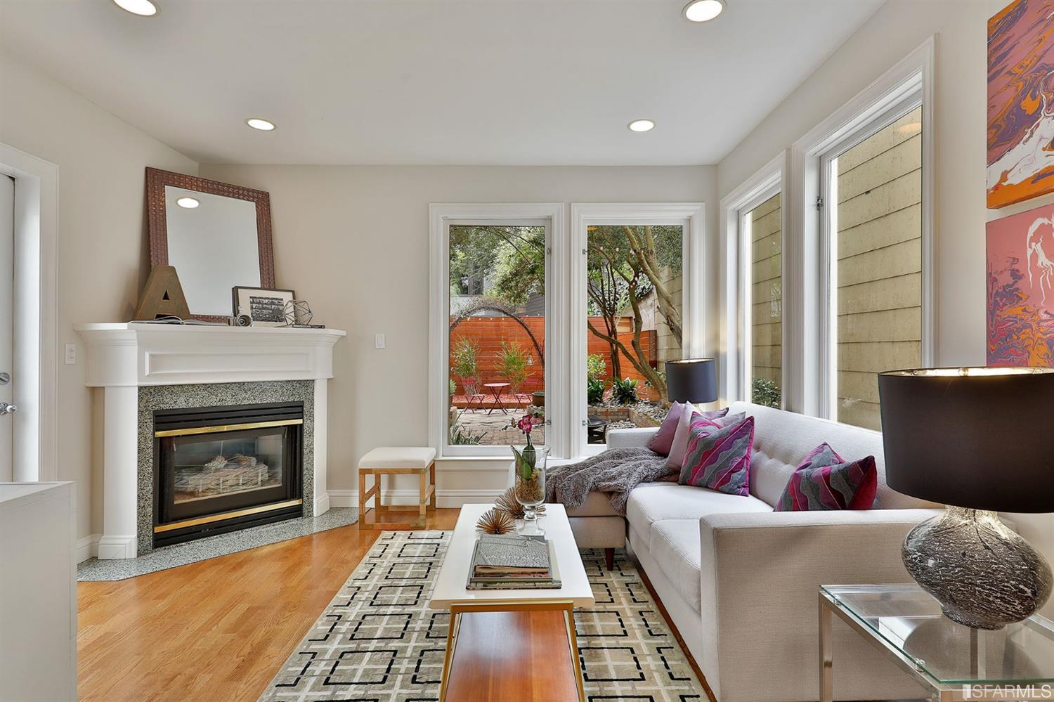 261 Henry Street, Unit A San Francisco, CA 94117 - Photo 36 of 64 a living room with furniture and a fireplace