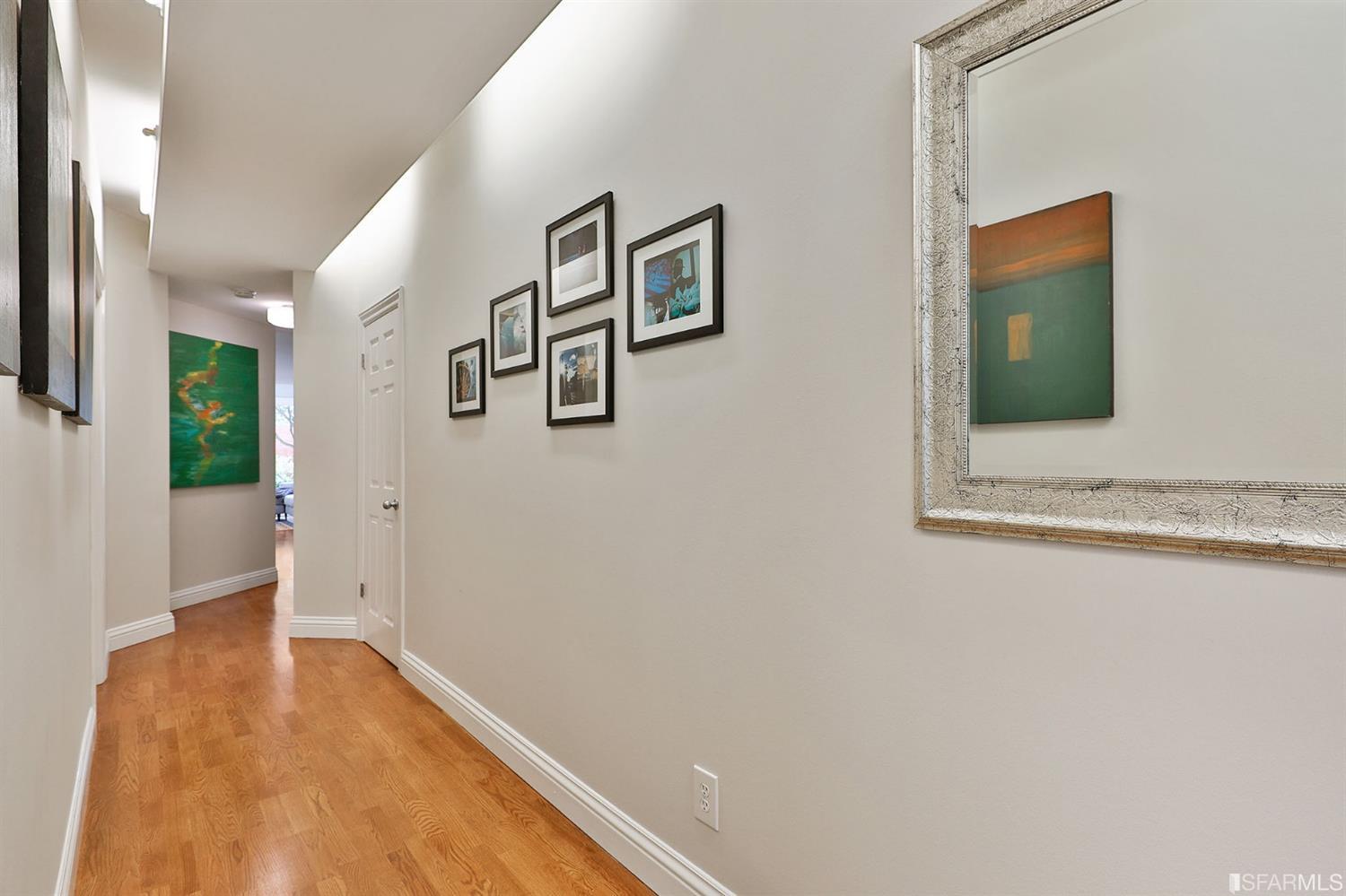 261 Henry Street, Unit A San Francisco, CA 94117 - Photo 50 of 64 a view of a hallway with wooden floor and cabinet