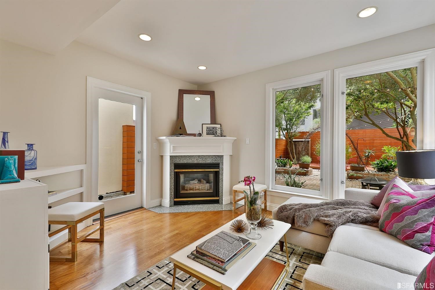 261 Henry Street, Unit A San Francisco, CA 94117 - Photo 5 of 64 a living room with furniture and a fireplace