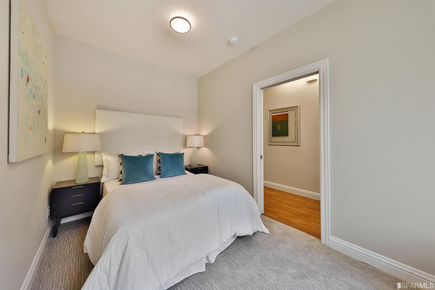 261 Henry Street, Unit A San Francisco, CA 94117 - Photo 57 of 64 a bedroom with a bed and a lamp