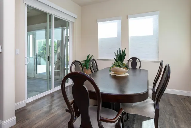 a large bed sitting in a bedroom next to a window