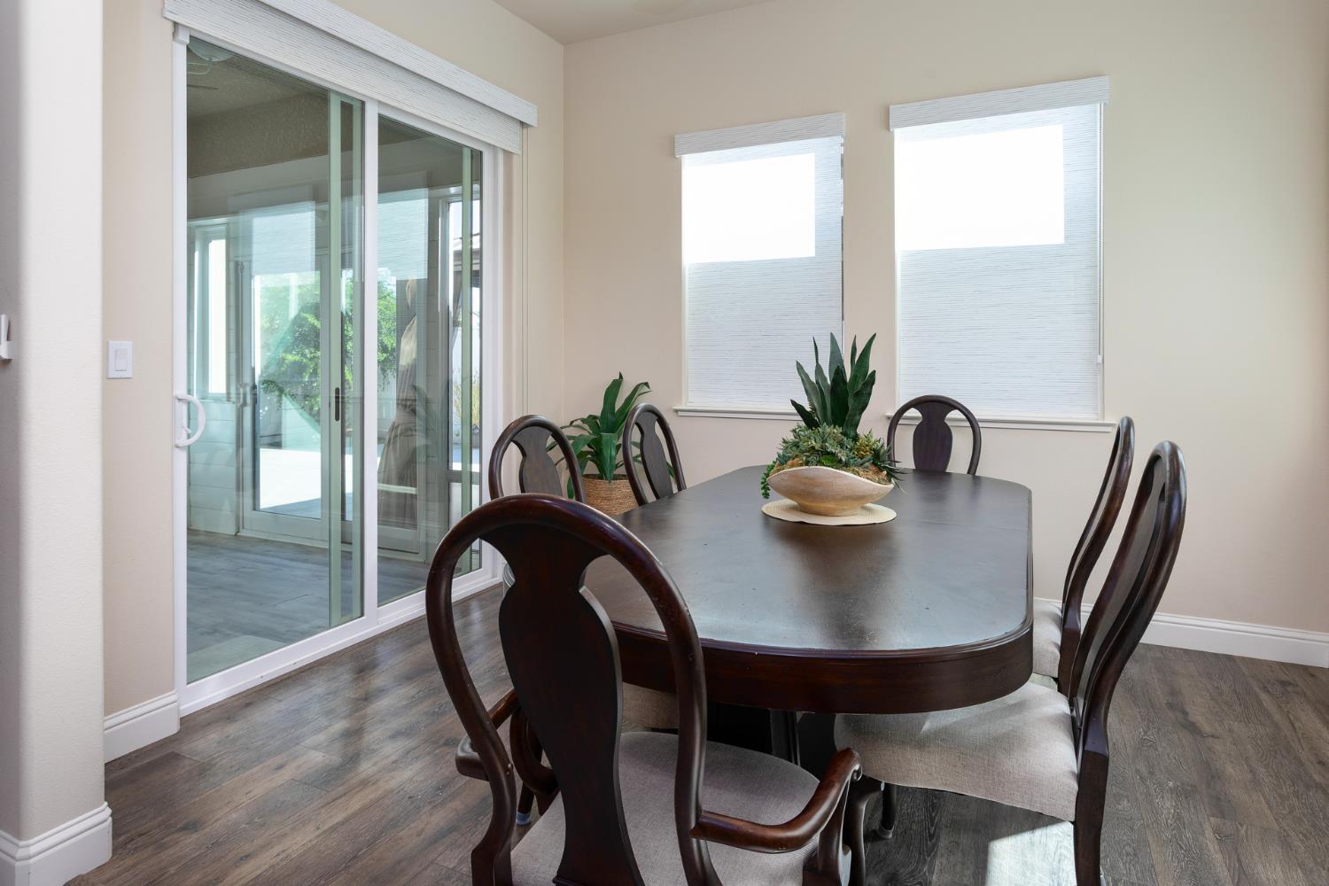 2227 North Highland Avenue Clovis, CA 93619 - Photo 15 of 48 a view of a dining room with furniture and wooden floor